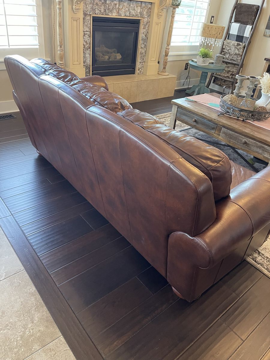 Traditional Brown Leather Sofa with Nailhead Trim.    Must go Monday the 10th.