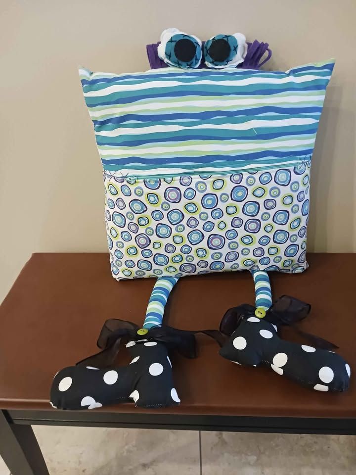 Pillow with eyes and legs