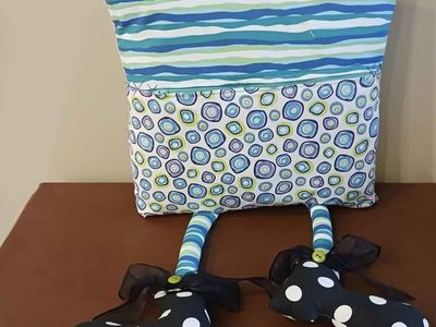 Pillow with eyes and legs