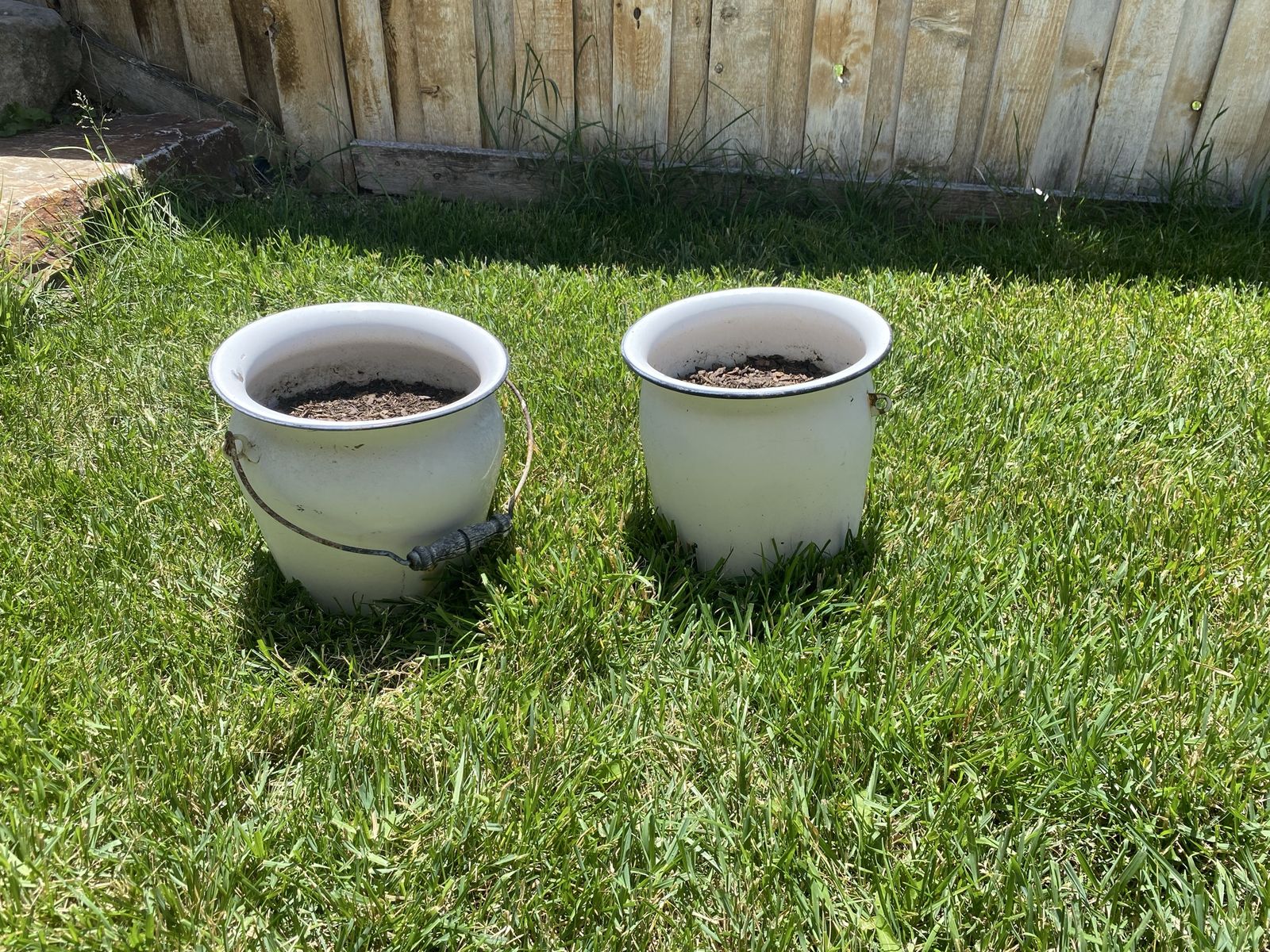 Two white metal pots