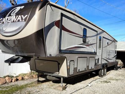 luxury 2015 Heartland Gateway 3900SE fifth wheel. 4 slide outs, approximately 500 sq ft.