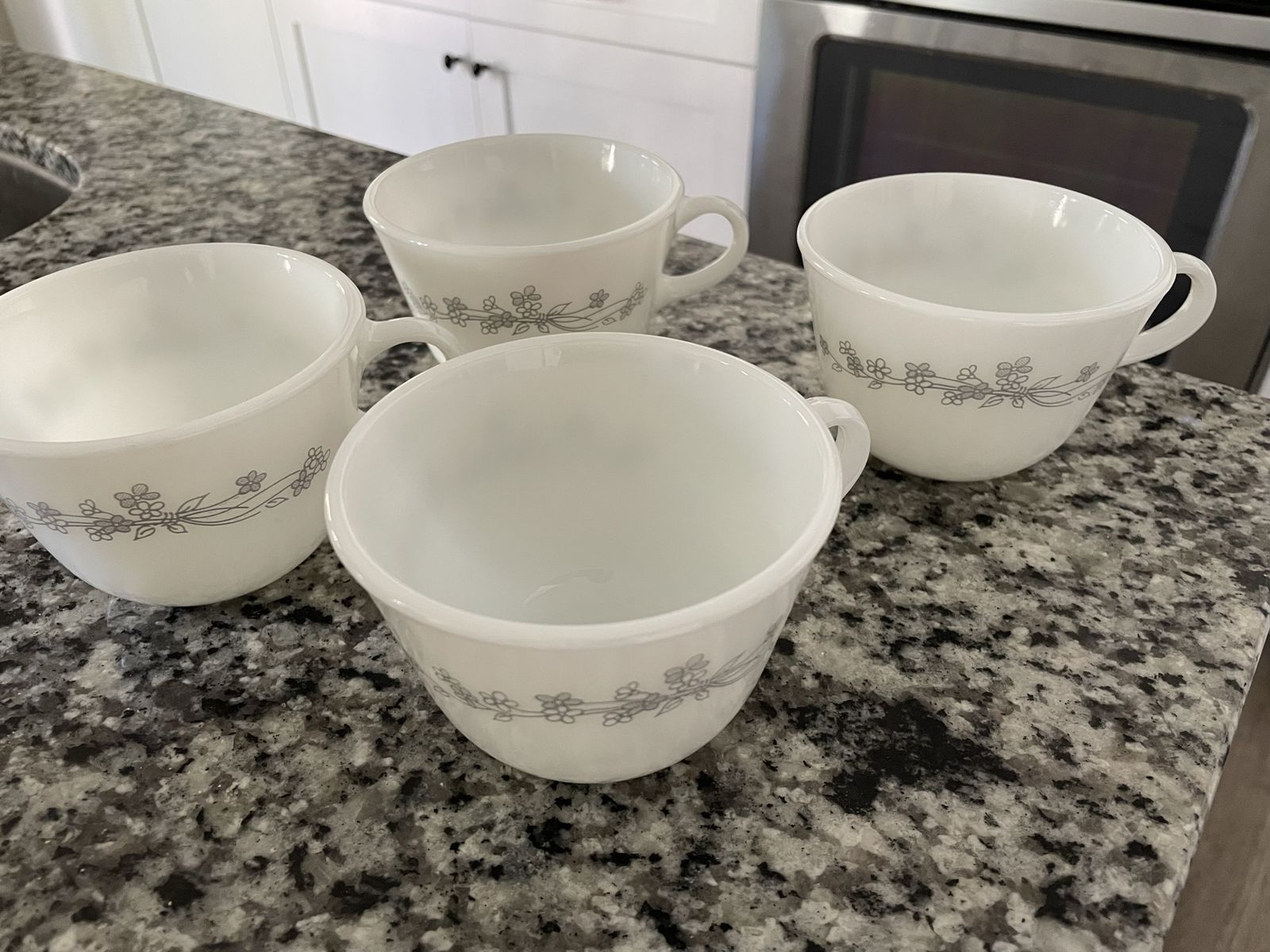Lot of 4 vintage Pyrex (by Corning) milk glass tea or coffee cups in the discontinued Ribbon Bouquet pattern