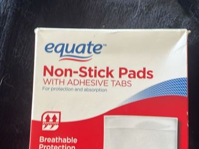 Non-stick Pads With Adhesive Tabs