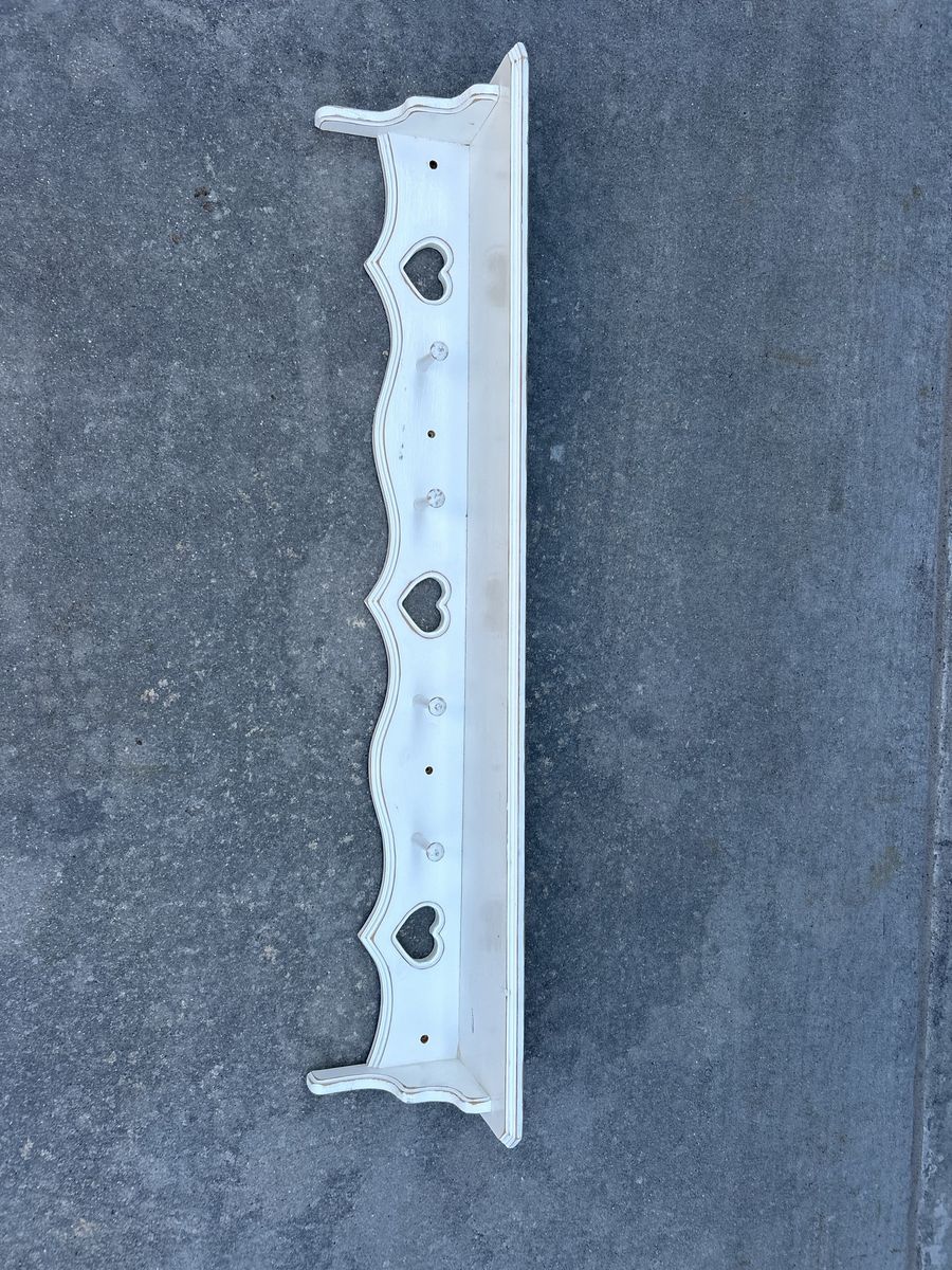 Vintage White Wooden Wall Shelf with Heart Cutouts and Peg Hooks