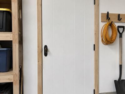 17 White Vertical Panel Interior Doors with Dark Hardware