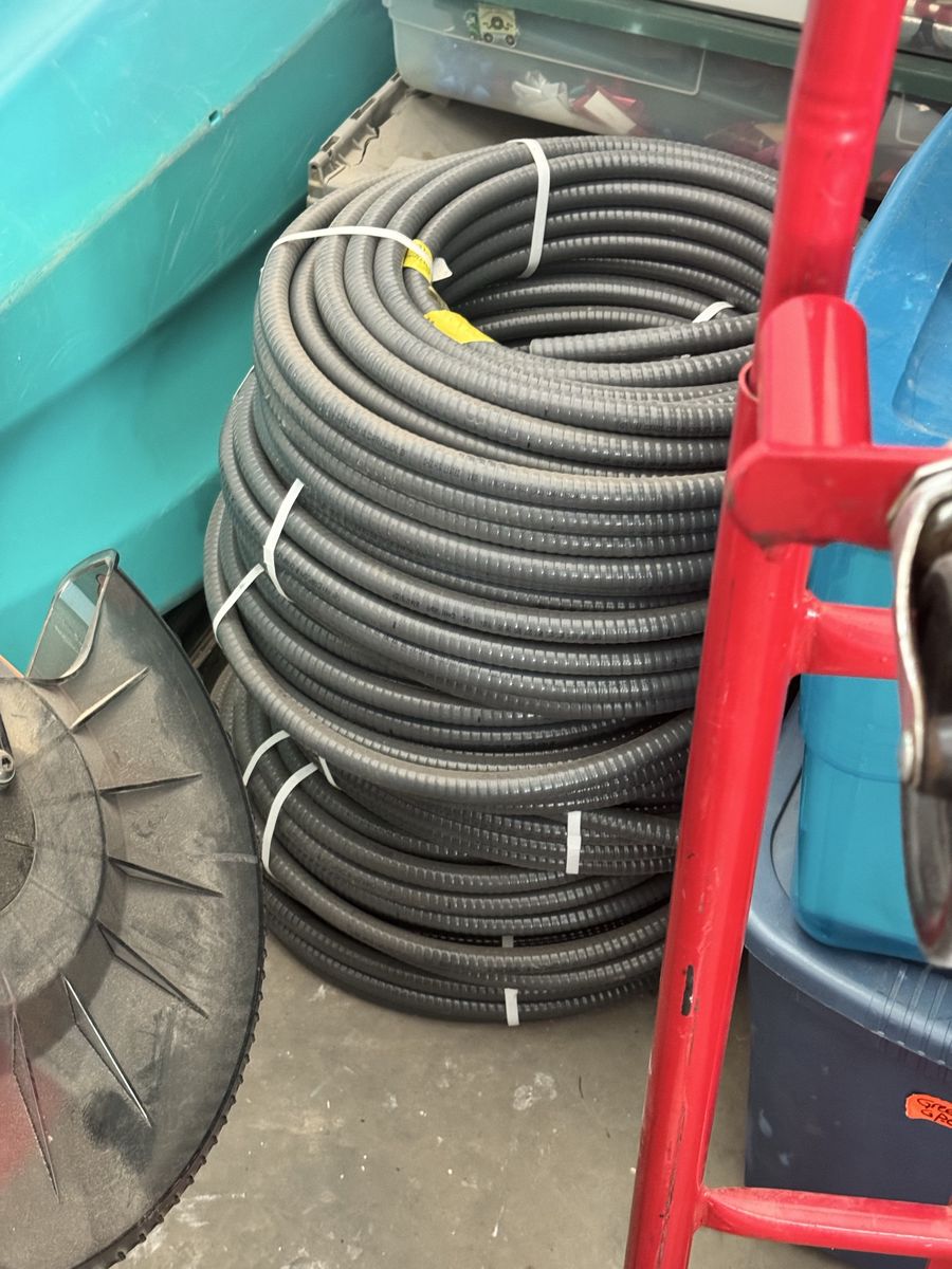 Large Coil of Gray Electrical Conduit - Flexible Plastic Tubing for Wiring Projects