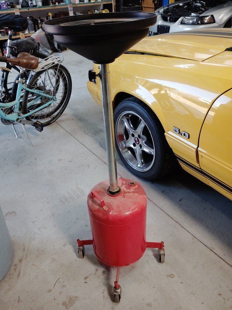 automotive oil drain lift kit thingy