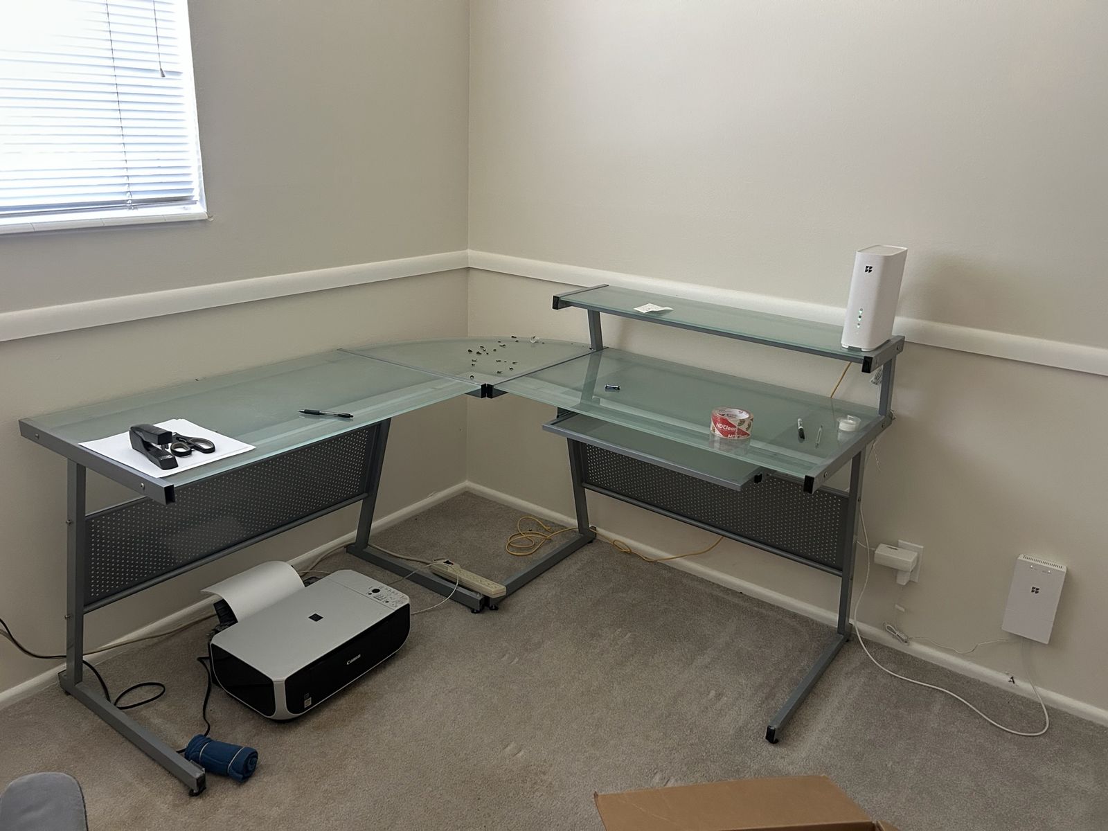 Glass top metal L-shaped desk