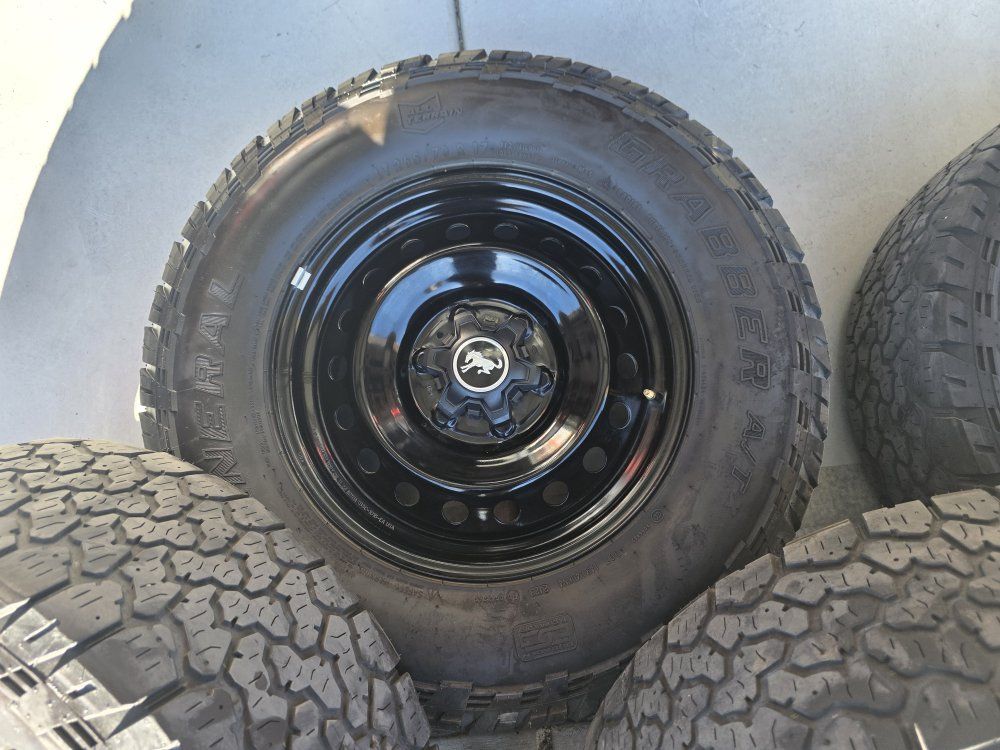 Bronco wheels and tires and caps. 265x70r17 