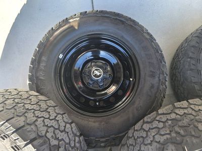 Bronco wheels and tires and caps. 265x70r17