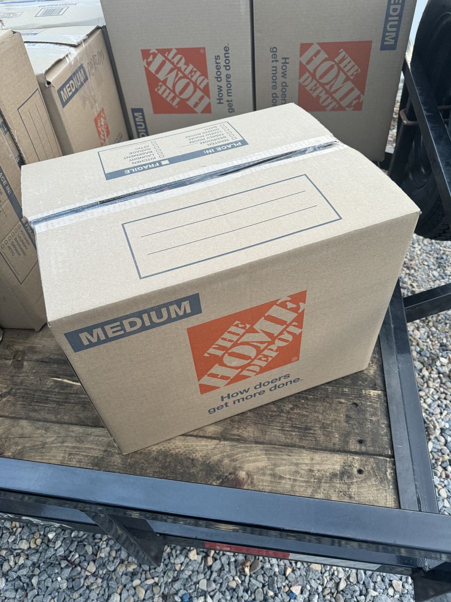 Box of 215 random videos games