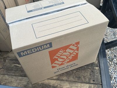 Box of 215 random videos games