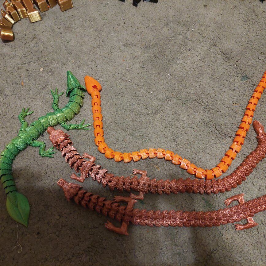 Flexi dragons and a snake 3d printed