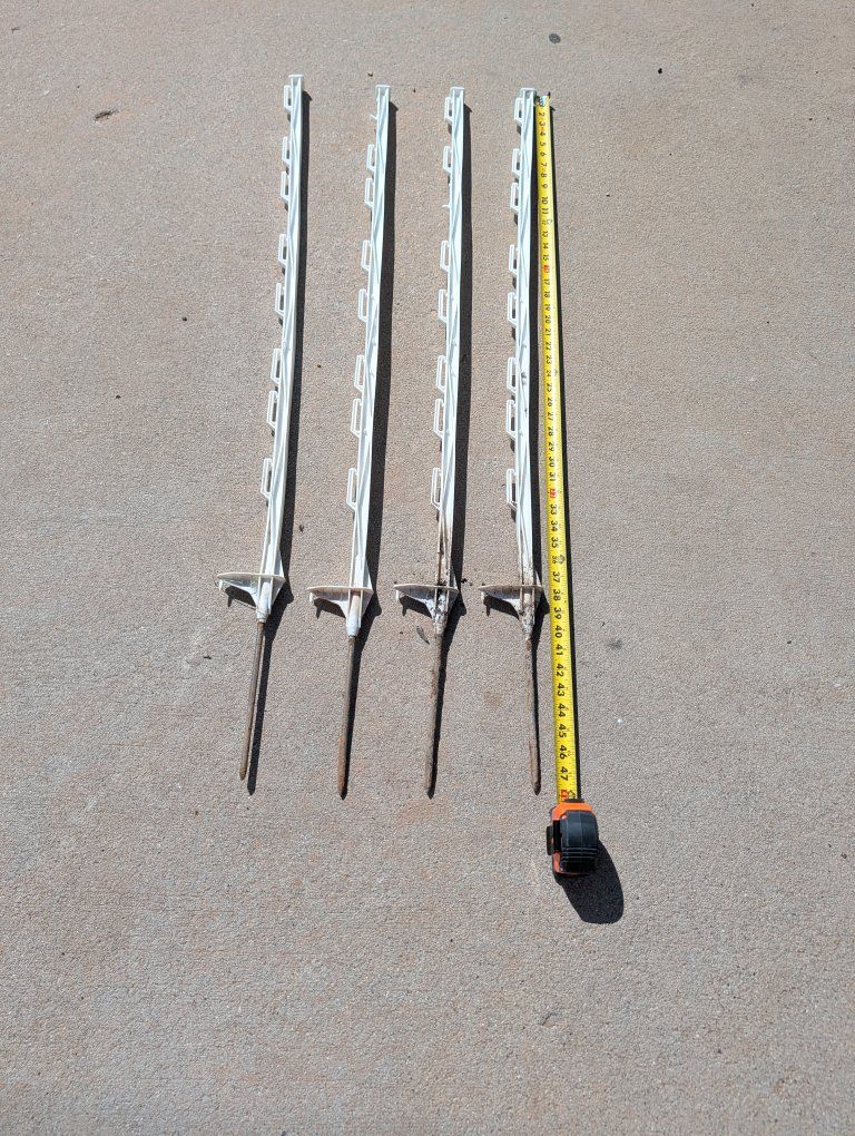 Set of 4 Used White PlasticFence Posts with Metal Spikes 48 Inches