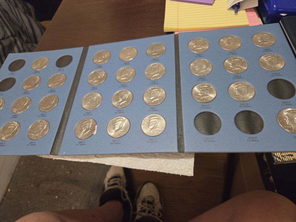 Kennedy half dollars plus book 3o coins or2 dollars each