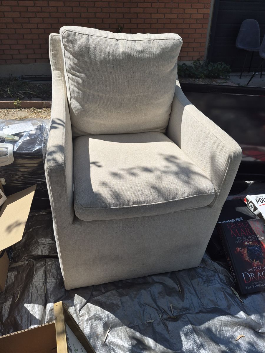 Small cream linen chair with wheels