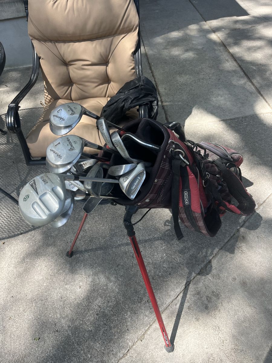 Ogio golf bag with clubs, two putters. Check pictures for more details