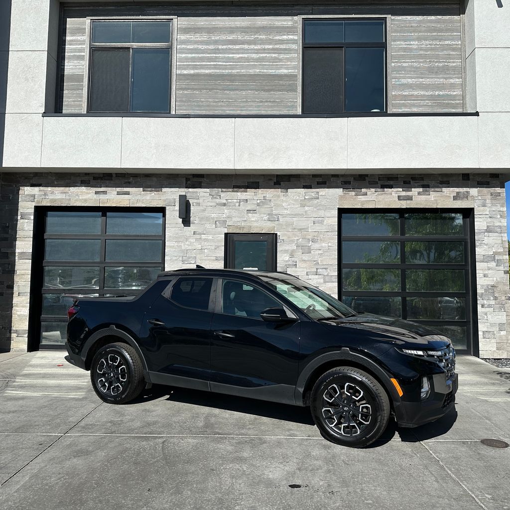 2023 Hyundai Santa Cruz SEL — rebuilt & branded title, 28% below market