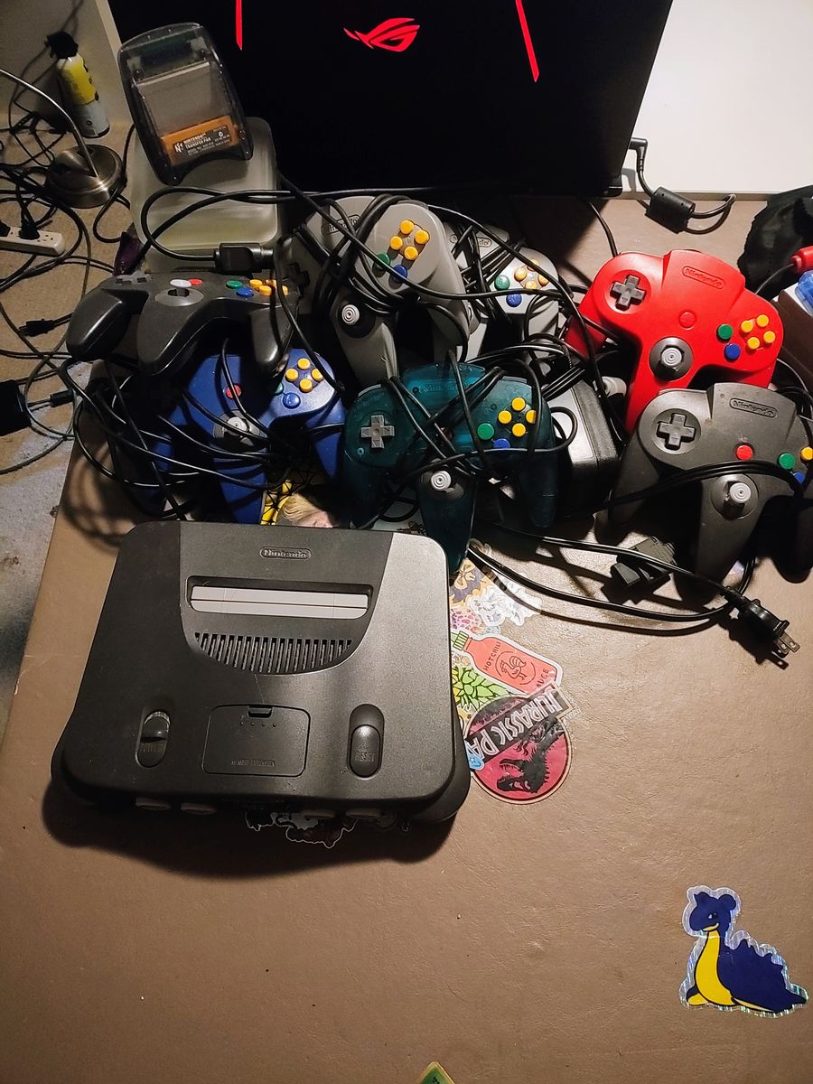 Huge n64 Nintendo 64 lot, console, 7 controllers, 27 games, transfer pack, memory cards and gameshark. All authentic.