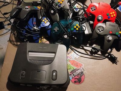 Huge n64 Nintendo 64 lot, console, 7 controllers, 27 games, transfer pack, memory cards and gameshark. All authentic.
