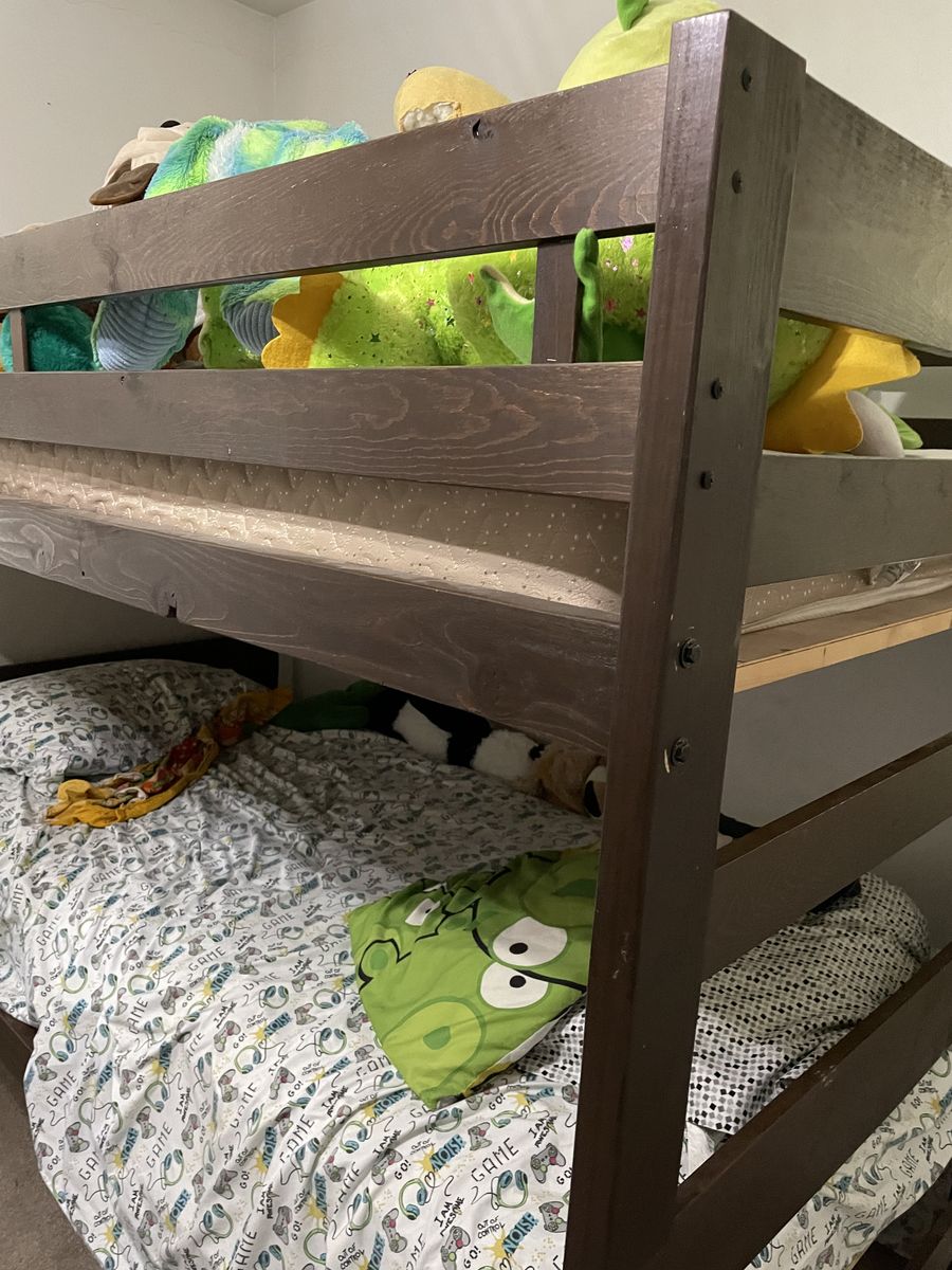 Rustic bunk bed with mattress