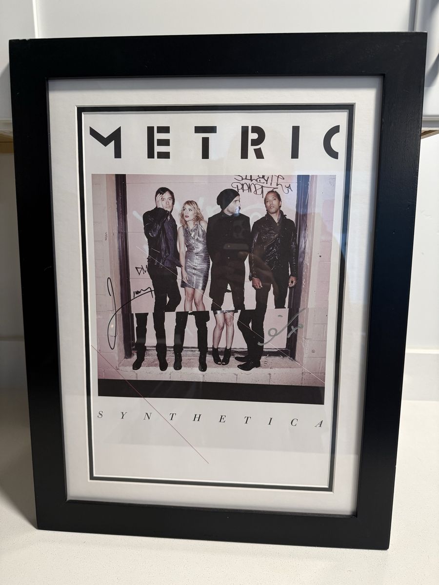 Framed Autographed Poster of the band Metric