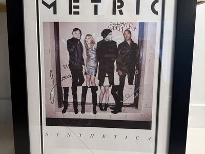 Framed Autographed Poster of the band Metric