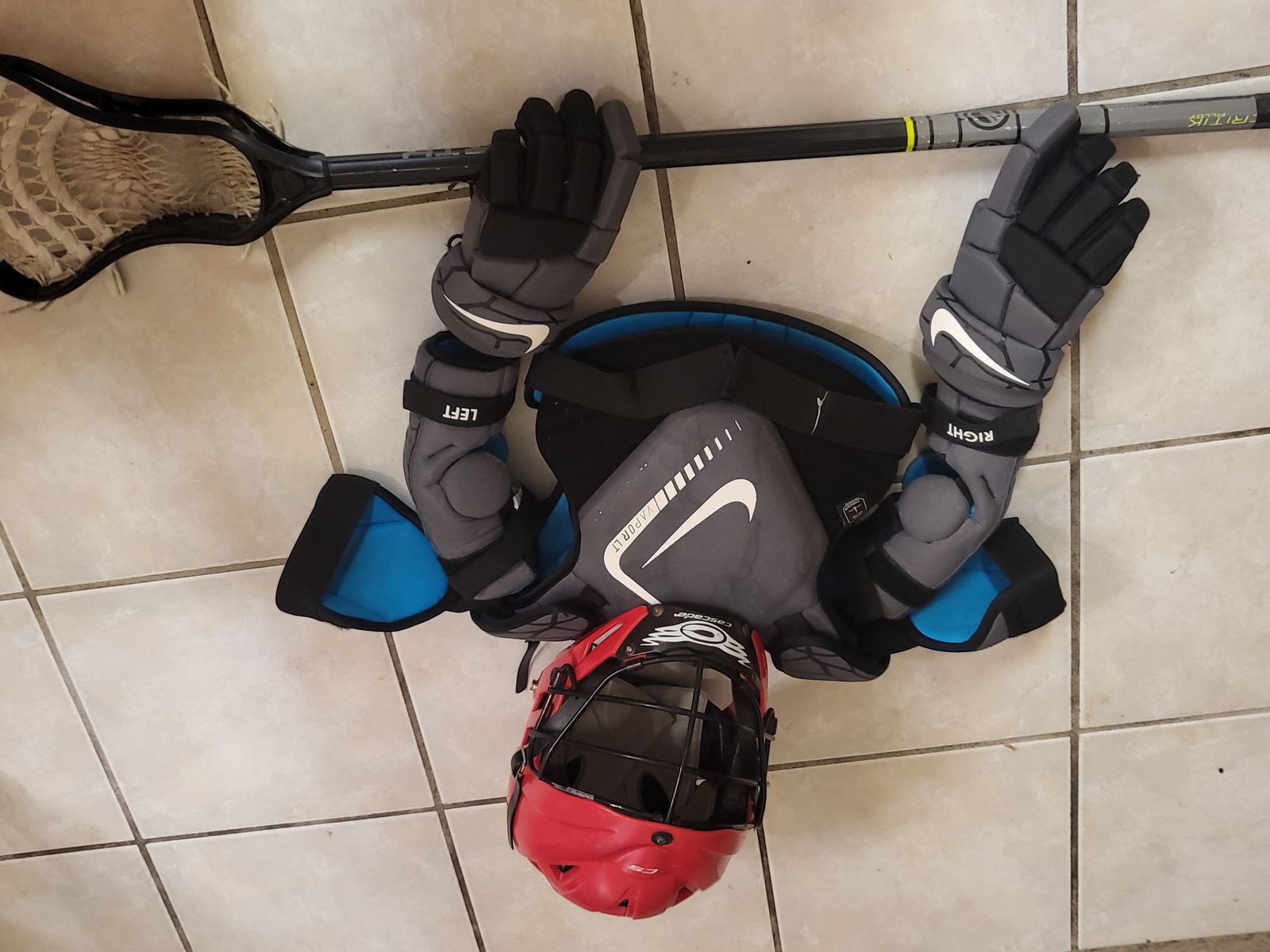 Full lacrosse gear including stick.