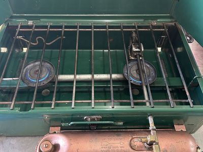 Coleman stove model 413E , with gold tank.