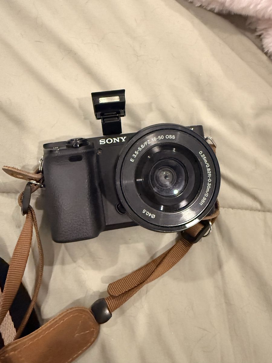Sony Alpha Mirrorless Camera with 16-50mm PZ OSS Lens and Brown Strap