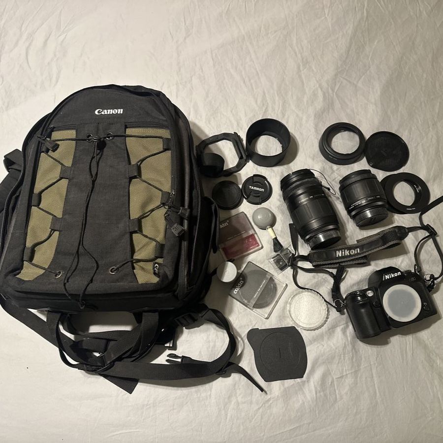 Nikon N80 SLR 35mm Film Camera with Two lenses, Accessories, and Camera bag.