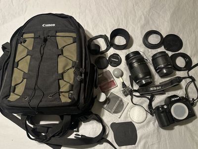 Nikon N80 SLR 35mm Film Camera with Two lenses, Accessories, and Camera bag.