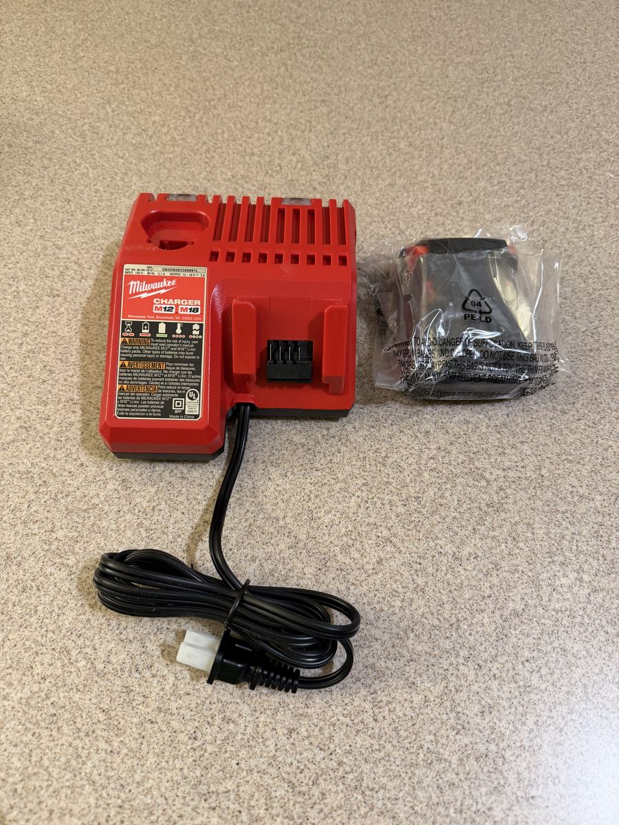 Brand new Milwaukee M18 1.5AH battery and charger