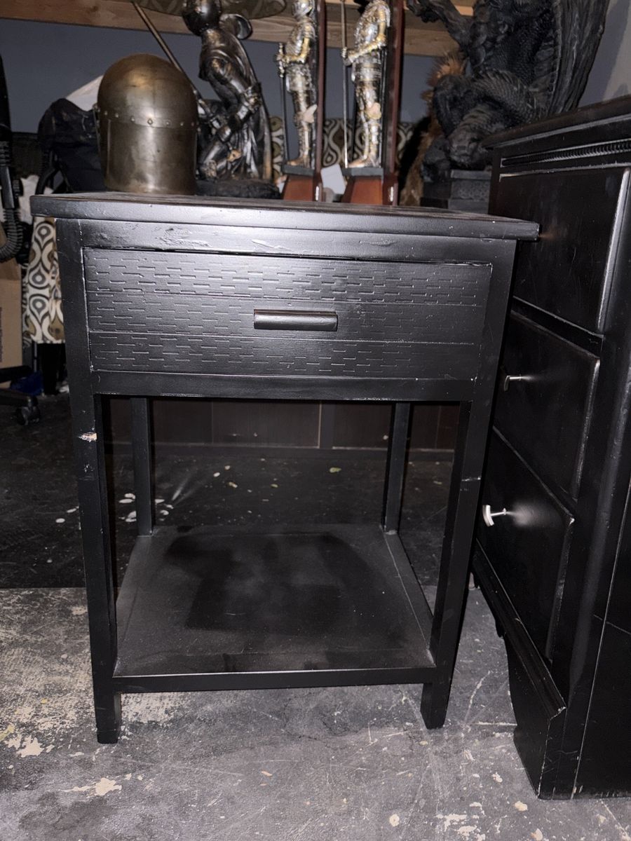 Black Wooden Nightstand with Textured Drawer Front and Lower Shelf