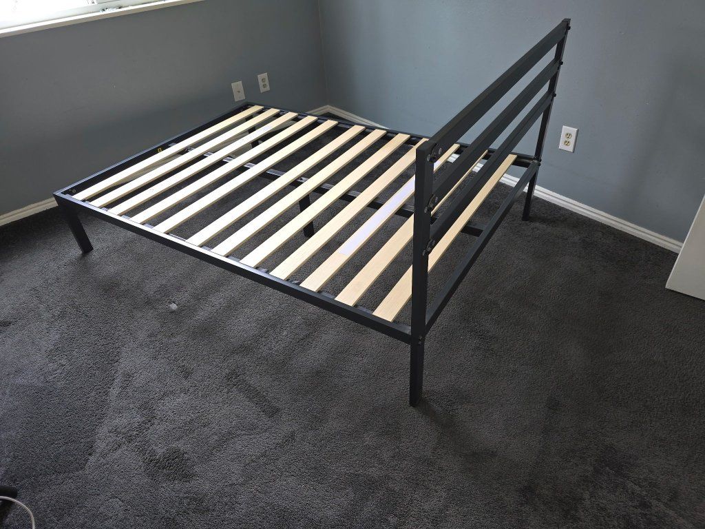 full size bed frame in great shape. needs a mattress. make me an offer.