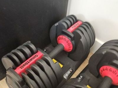 Pair of adjustable dumbells 52.5 lbs each