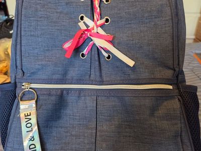 Stylish Blue Backpack with "Be Kind & Love" Tag and Ribbon Lacing Detail - Great for School or Travel