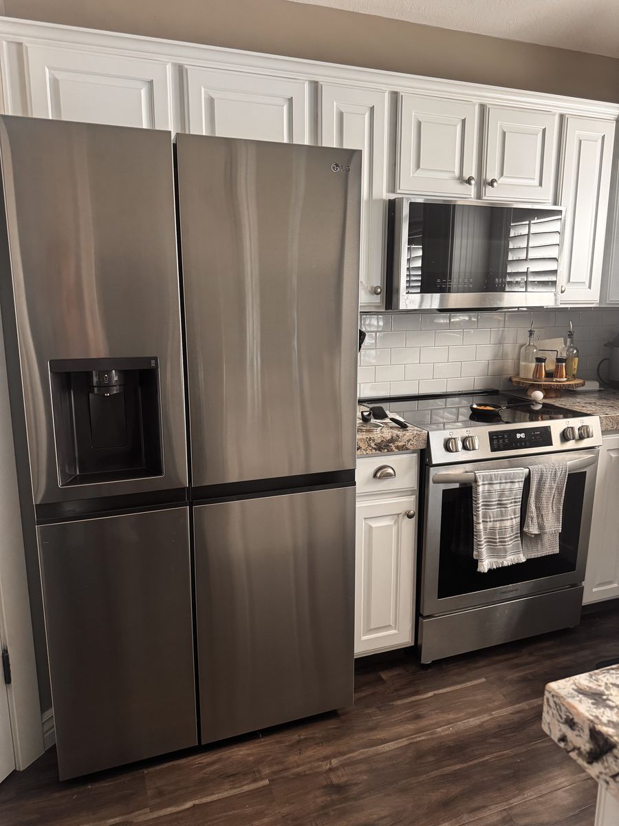 LG Stainless Steel Fridge and Frigidaire Range