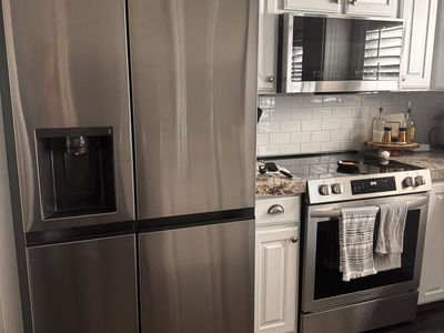 LG Stainless Steel Fridge and Frigidaire Range