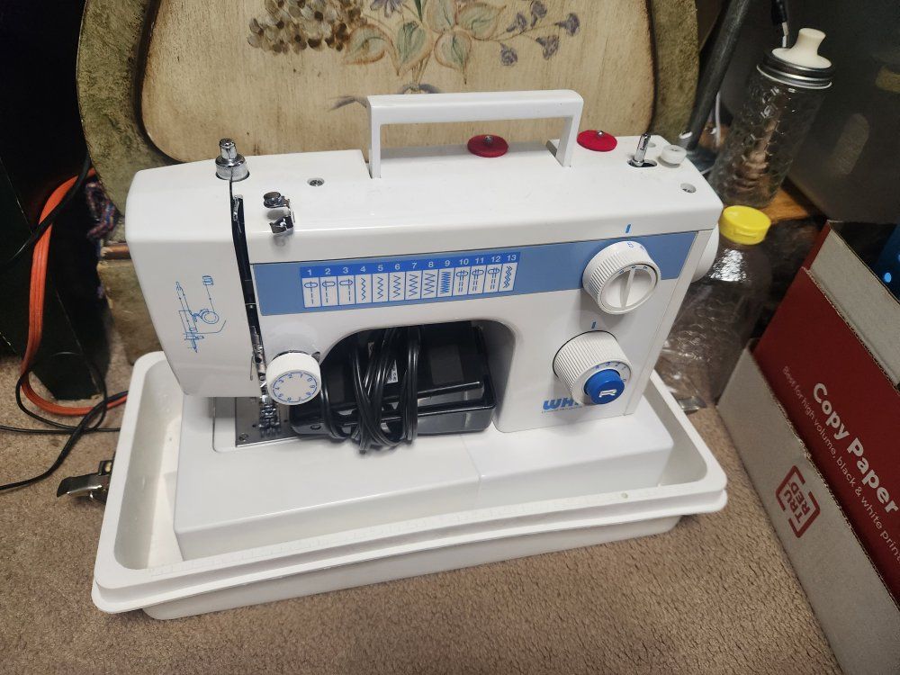 white sewing machine and case