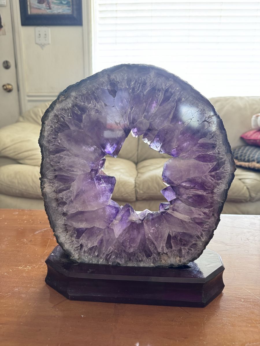 Natural Amethyst Crystal Geode Ring on Wooden Stand