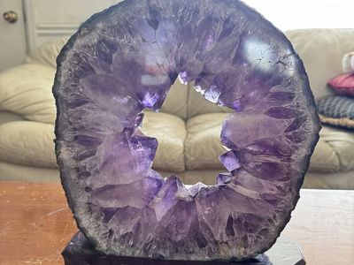 Natural Amethyst Crystal Geode Ring on Wooden Stand