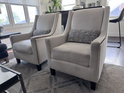 Pair of off white Armchairs with Nailhead Trim & Accent Pillows