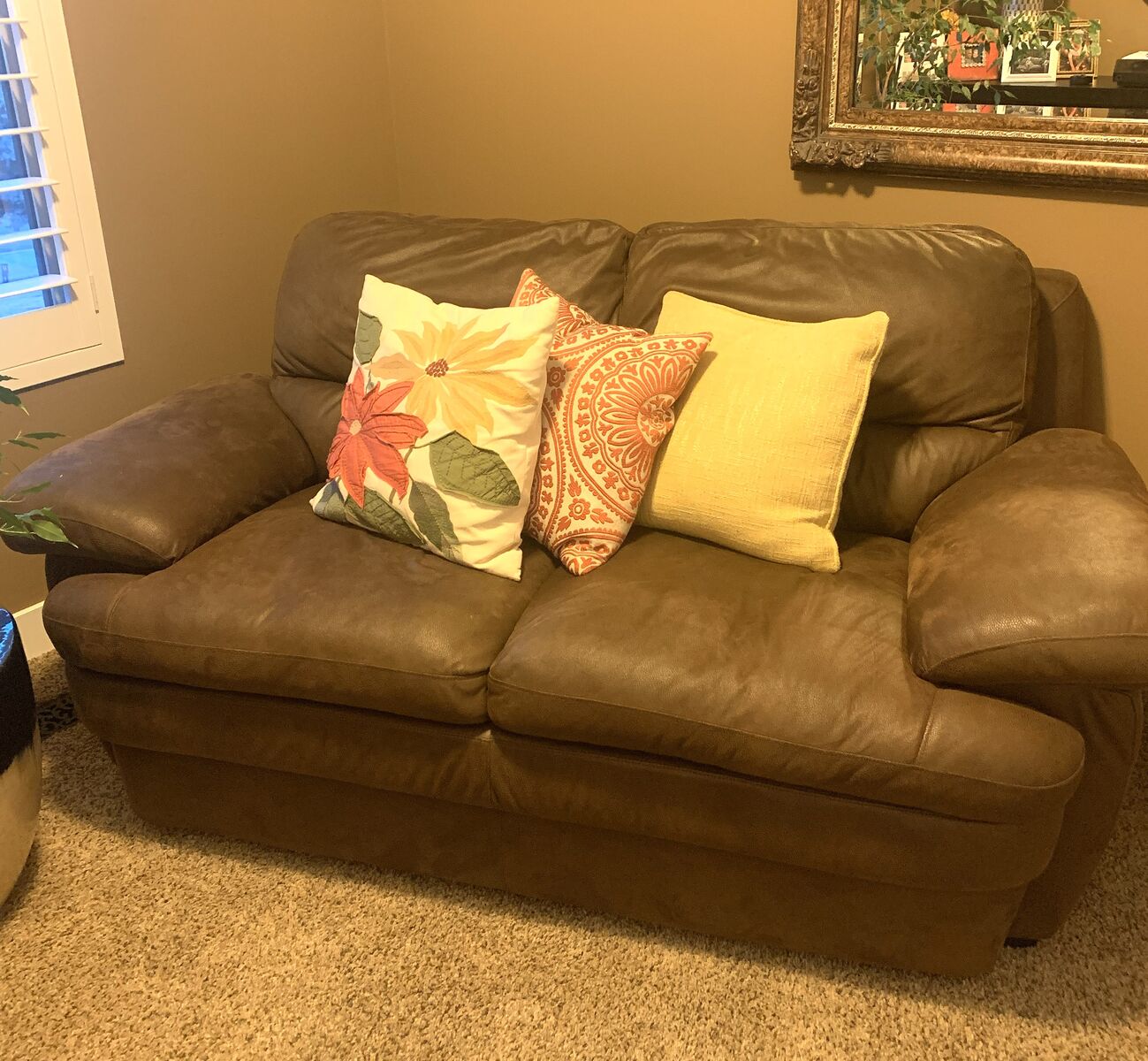 Brown suede loveseat