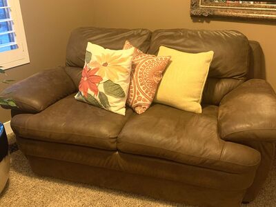 Brown suede loveseat