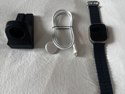 Apple Watch Ultra with Ocean Band, Charging Cable, and Stand