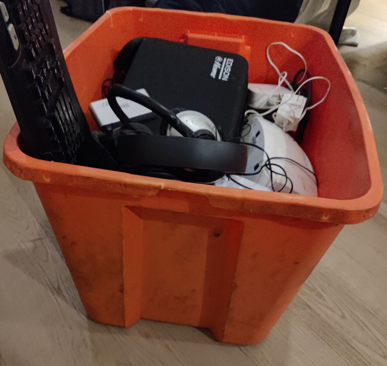 Tote of various consumer electronics, headphones, laptops, streaming, cables, and more