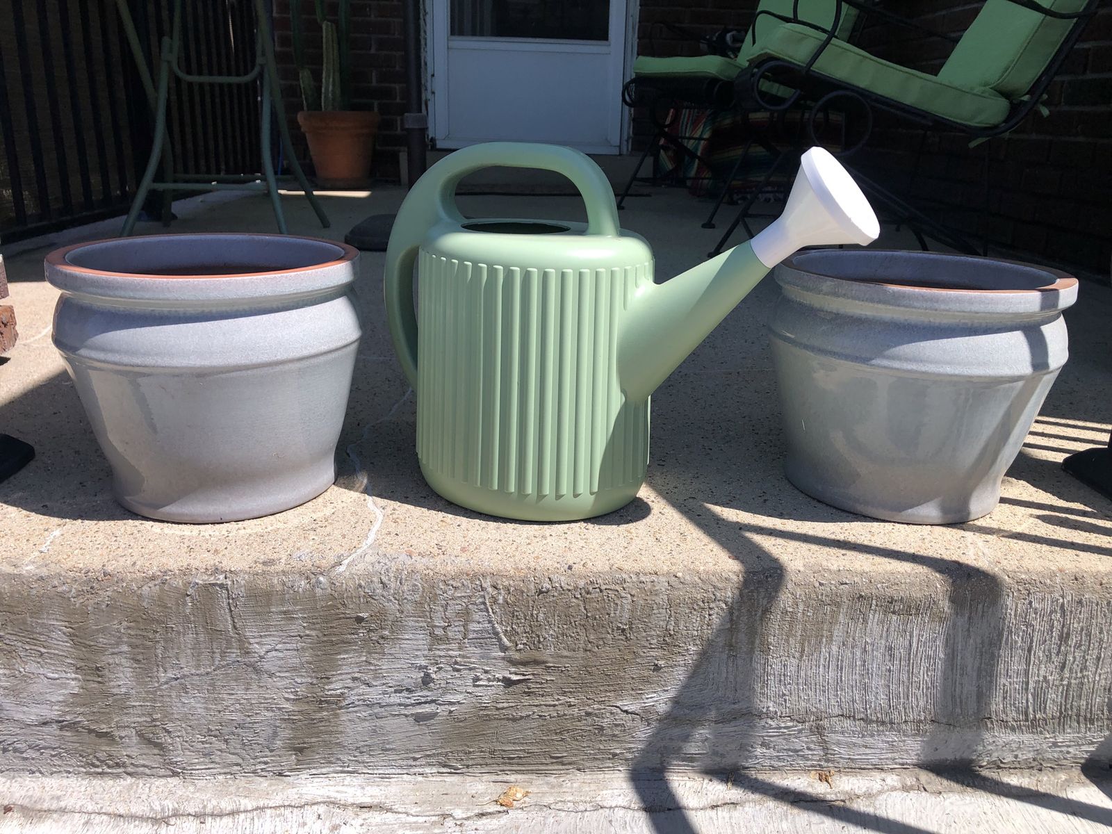 Two 10 inch plant pots & plastic watering can