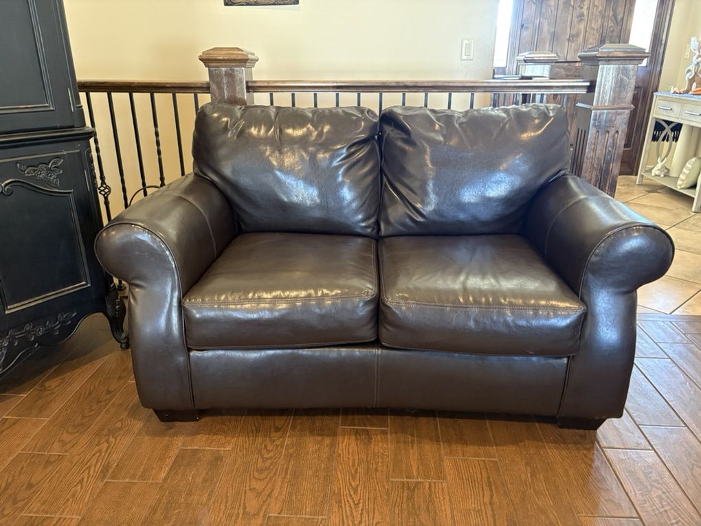 Gently Used Faux Leather Love Seat