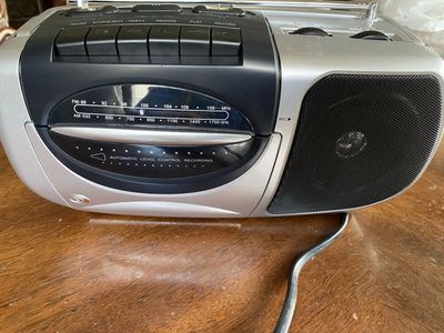 Portable cassette player and radio plug in or battery operated